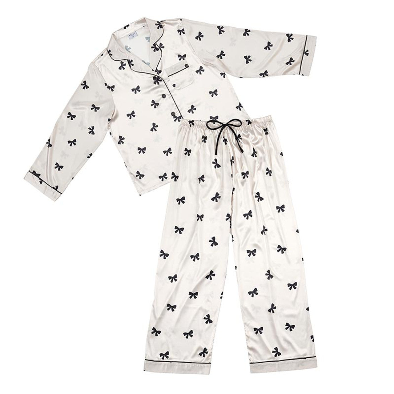 Indulge in sweet dreams with our luxurious Sweet Dreams Bow PJ Set. This long sleeve PJ set features delicate ivory fabric adorned with black bows, for a touch of elegance. The perfect combination of comfort and style, let these PJs take you to a blissful night's sleep.