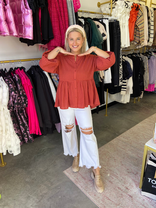 Show off your autumn style with this delightful Pumpkin Swirl Top! Featuring a rust button down, this plaid top is perfect for creating that perfect pumpkin patch picture. Put your spin on fall fashion and do it with a smile!