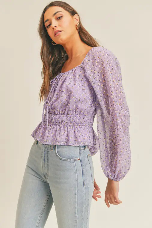 The Pretty Please Top is a floral print tie front blouse with a square neckline. Its supple waistbands nips you at the ideal spot. The flouncy hemline and sheer-sleeved design lend a dreamy touch. The delicate and romantic look is perfect for a date night or casual lunch. You'll turn heads in this timeless yet modern piece.