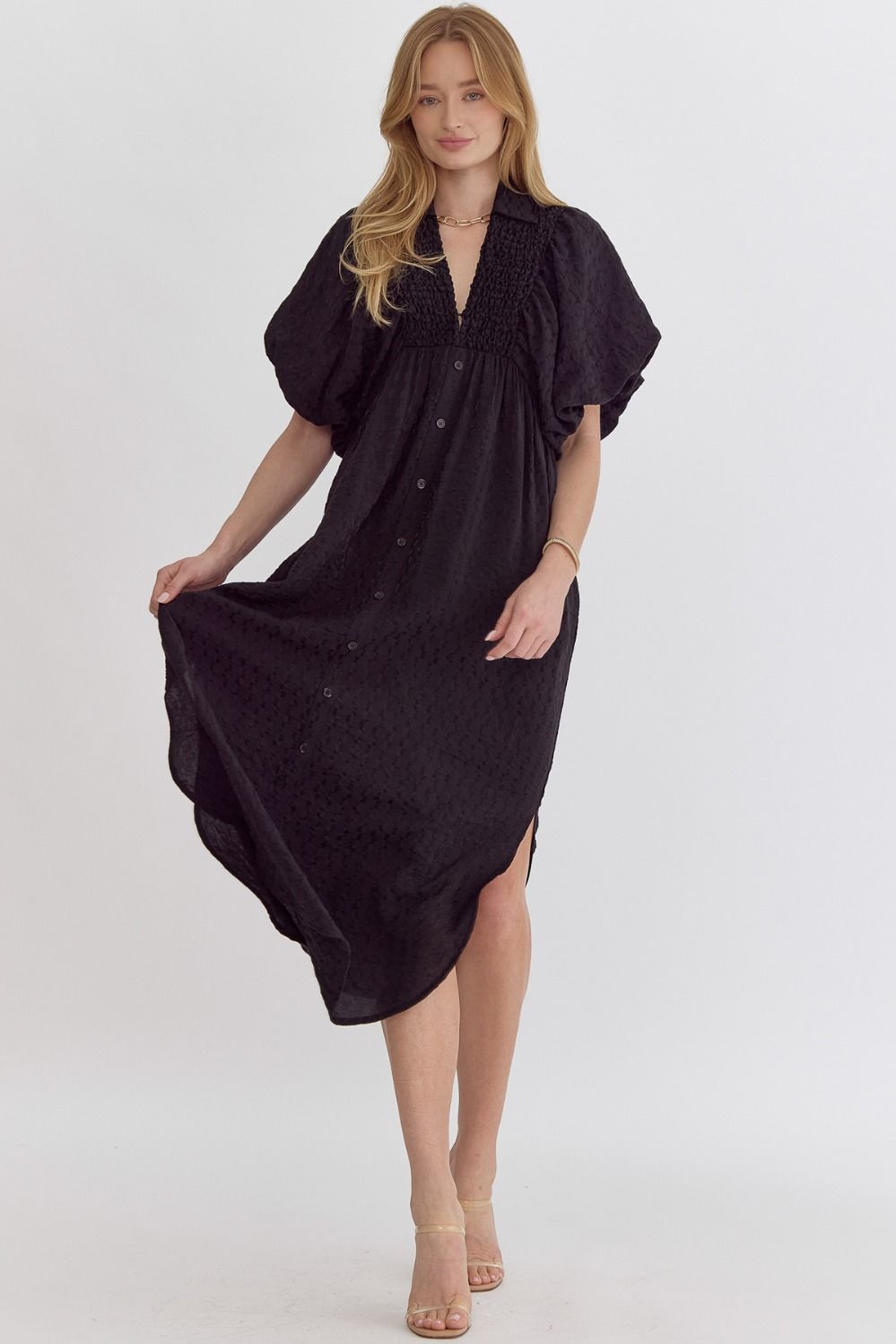 Slip into ultimate comfort and style with our Comfy &amp; Casual Dress! This midi dress features textured fabric, a flattering v-neckline, and playful bubble sleeves. The smocking detail at the chest adds a touch of charm, while the side slit and elastic cuffs provide a comfortable fit. Perfect for any occasion, this dress is lightweight and semi-sheer, making it a must-have for any wardrobe.