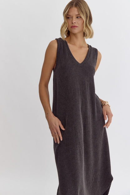Introducing the Hit Pause Dress - a must-have for any fashion-forward individual! This solid ribbed v-neck sleeveless midi dress features a unique round hem detail, making it a standout piece in your wardrobe. The lightweight, knit fabric is non-sheer and unlined, ensuring ultimate comfort and versatility. Hit pause on your busy schedule and unwind in style with this stunning dress!