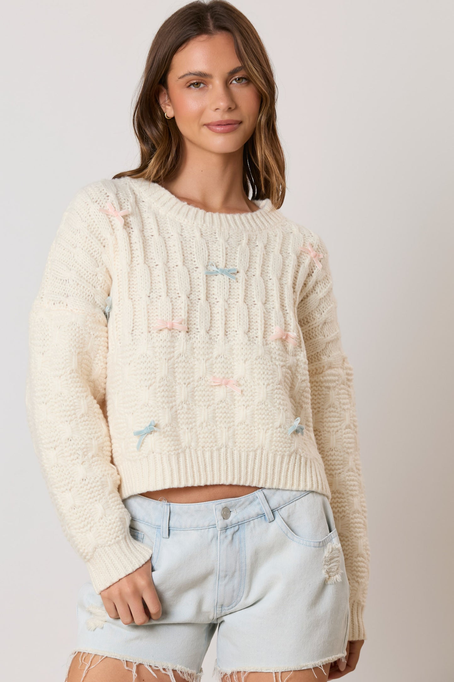 Introducing the Bow Era Sweater - the perfect combination of comfort and style with its soft velvet ribbon and long sleeves. Get ready to add a touch of elegance to your wardrobe!