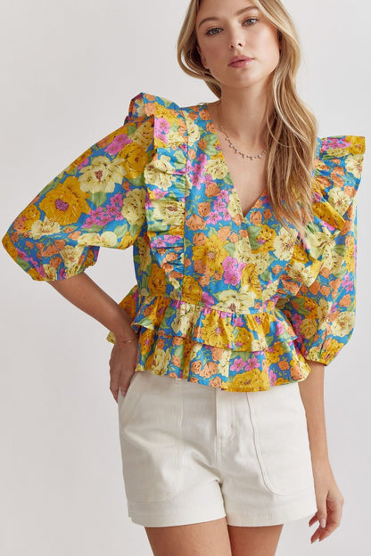 Unleash your inner fashionista with our floral print v-neck peplum top! The stylish 3/4 sleeves and ruffle detail add a touch of femininity while the snap button closure provides convenience. This lightweight and non-sheer top is perfect for any occasion - from casual gatherings to dressy events!