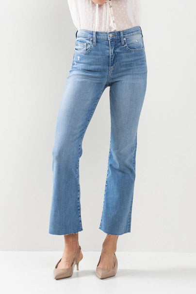 Take your denim game to the next level with The Hannah Jeans. These high-rise kick flare jeans in medium wash feature a raw cut hem for a touch of edge. Say goodbye to boring denim and hello to a new level of style!