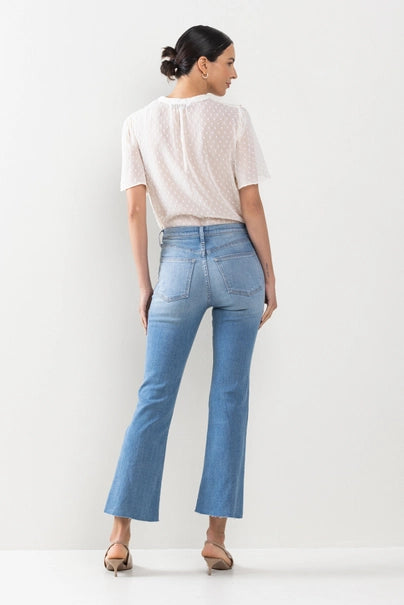 Take your denim game to the next level with The Hannah Jeans. These high-rise kick flare jeans in medium wash feature a raw cut hem for a touch of edge. Say goodbye to boring denim and hello to a new level of style!