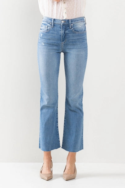 Take your denim game to the next level with The Hannah Jeans. These high-rise kick flare jeans in medium wash feature a raw cut hem for a touch of edge. Say goodbye to boring denim and hello to a new level of style!