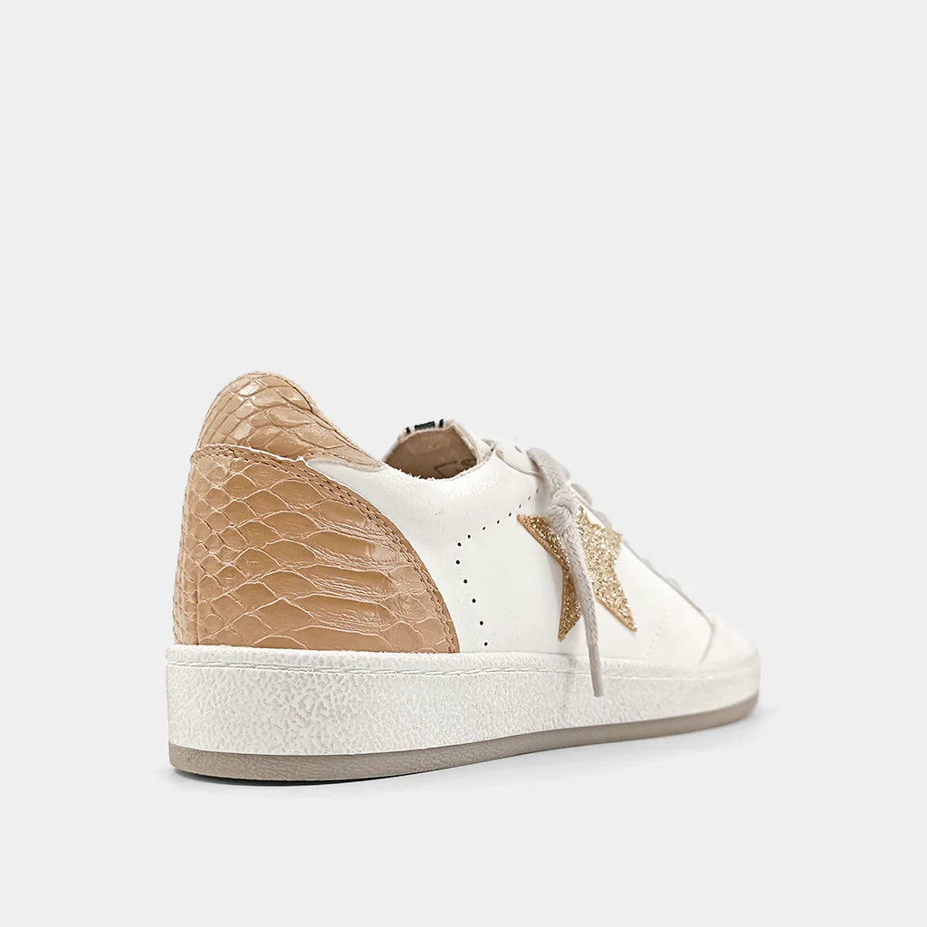 PAZ is one of our favorite must-have retro sneaker, with a low top upper body crafted in faux leather, synthetic snakeskin and glitter in contrasting white and taupe accents. These look amazing paired with shorts, cropped jeans and dresses.