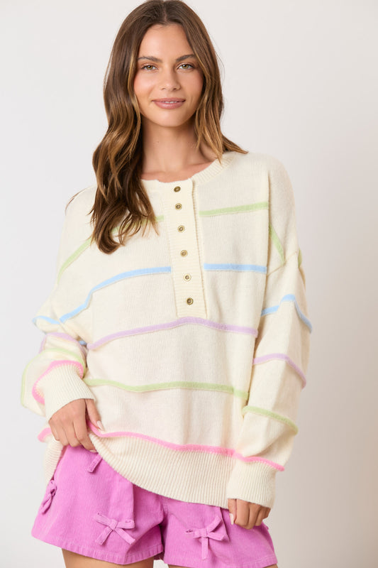 Wrap yourself in the vibrant colors of our Favorite Time Sweater! Featuring a charming multi-color stripe design and adorable buttons, this sweater will add a pop of personality to any outfit. Stay warm and stylish all day long!