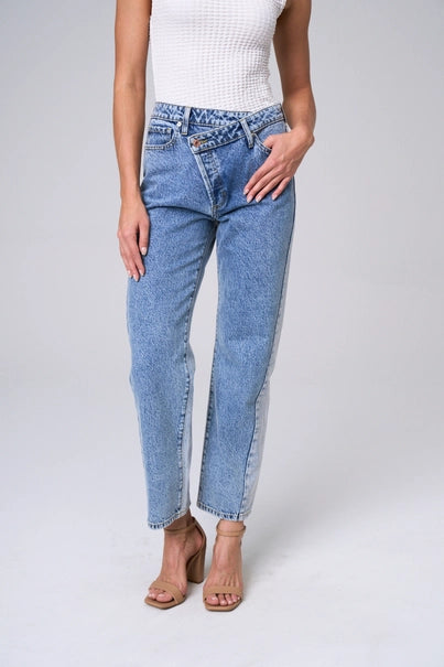 Elevate your wardrobe with The Brette Jeans. Experience the snug fit and high rise waist that flatters your figure. The unique criss-cross design adds a stylish touch, while the wide straight legs provide comfort and versatility. Make a statement with the light two-tone wash.